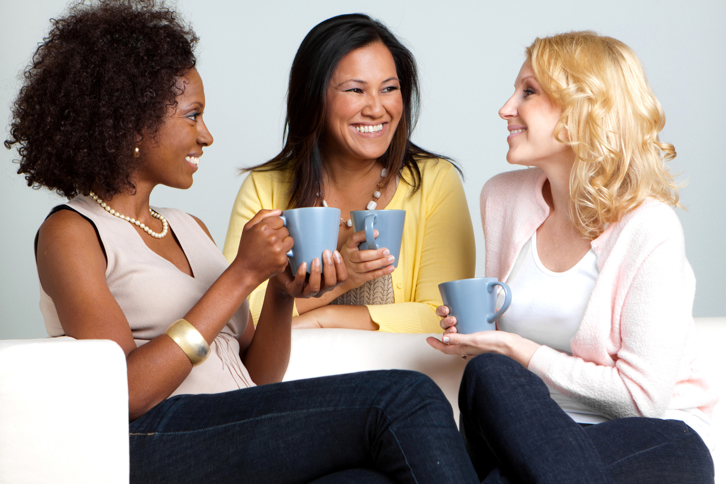 Diverse Group of Women Talking and Drinking Coffee