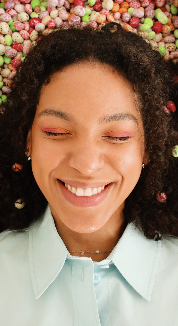 Woman Surrounded with Small Easter Eggs